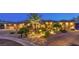 Inviting home exterior with desert landscaping, paver driveway, and illuminated pathway at 9135 Hickam Ave, Las Vegas, NV 89129