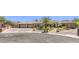 Attractive stone and stucco home features a spacious three-car garage and mature landscaping at 9135 Hickam Ave, Las Vegas, NV 89129