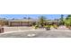 Attractive stone and stucco home features a spacious three-car garage and mature landscaping at 9135 Hickam Ave, Las Vegas, NV 89129