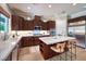 Modern kitchen with stainless steel appliances, granite countertops, and a center island at 9135 Hickam Ave, Las Vegas, NV 89129
