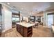 Open kitchen featuring a center island, modern appliances, and hardwood floors at 9135 Hickam Ave, Las Vegas, NV 89129