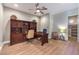 Comfortable home office featuring custom built-in cabinets, a large desk, and ample natural light at 9135 Hickam Ave, Las Vegas, NV 89129