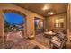 Inviting outdoor patio with a stone fire pit, comfortable seating, and durable pavers at 9135 Hickam Ave, Las Vegas, NV 89129