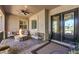 Inviting outdoor patio with a stone fire pit, comfortable seating, and durable pavers at 9135 Hickam Ave, Las Vegas, NV 89129