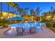 Inviting pool area with comfortable lounge chairs and privacy landscaping, ideal for relaxing and entertaining at 9135 Hickam Ave, Las Vegas, NV 89129