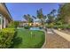 Dusk view of backyard featuring putting green and lush landscaping at 9135 Hickam Ave, Las Vegas, NV 89129
