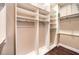 Spacious walk-in closet with custom shelving and hanging racks at 9135 Hickam Ave, Las Vegas, NV 89129