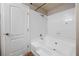 This bathroom features an all-white tiled shower and tub combination with a clean, modern design at 9325 W Desert Inn Rd # 104, Las Vegas, NV 89117
