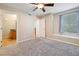 Bright bedroom with carpet and a window seat near the bathroom entrance at 9325 W Desert Inn Rd # 104, Las Vegas, NV 89117
