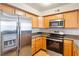 Well-equipped kitchen showcasing stainless steel appliances, granite countertops, and ample cabinet space at 9325 W Desert Inn Rd # 104, Las Vegas, NV 89117