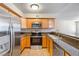 Well-lit kitchen with stainless steel appliances and granite countertops at 9325 W Desert Inn Rd # 104, Las Vegas, NV 89117