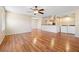 Spacious living area with hardwood floors, complemented by a view of the kitchen and a laundry area at 9325 W Desert Inn Rd # 104, Las Vegas, NV 89117