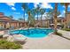 A large, inviting pool is surrounded by palm trees and lounge chairs, perfect for relaxation at 9325 W Desert Inn Rd # 104, Las Vegas, NV 89117