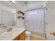 Cozy bathroom features a single sink vanity, toilet, and a shower-tub combo with a stylish patterned shower curtain at 100 Crossfoot Terrace Ct, Henderson, NV 89002