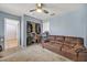 Comfortable bedroom featuring a large sofa, closet, and bathroom access; perfect for relaxation and convenience at 100 Crossfoot Terrace Ct, Henderson, NV 89002