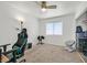 Functional carpeted bedroom with ceiling fan, window for natural light, and organized closet storage solutions at 100 Crossfoot Terrace Ct, Henderson, NV 89002