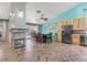 Spacious dining area with a modern fireplace, a stylish dining set, and access to the outdoor space at 100 Crossfoot Terrace Ct, Henderson, NV 89002