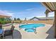 Inviting backyard pool area with a spa, seating, and ample space for outdoor entertaining and relaxation at 100 Crossfoot Terrace Ct, Henderson, NV 89002