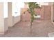 Gravel side yard with block wall and metal gate, providing privacy at 1025 Appaloosa Hills Ave, North Las Vegas, NV 89081
