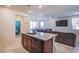 View of the kitchen island looking into the living room with access to the dining room at 104 Pollentia Ave, North Las Vegas, NV 89084