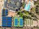 Overhead shot of community center featuring tennis courts, bocce ball, a swimming pool, clubhouse, and well-maintained landscaping at 10413 Marymont Pl, Las Vegas, NV 89134