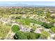 Expansive aerial view featuring lush parks, mature trees, and well-maintained walking paths within community at 10413 Marymont Pl, Las Vegas, NV 89134