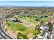 Extensive aerial perspective of the golf course community, complete with pristine landscaping and a serene atmosphere at 10413 Marymont Pl, Las Vegas, NV 89134