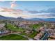 Panoramic aerial view of the Sun City Summerlin community with the golf course and mountains in the background at 10413 Marymont Pl, Las Vegas, NV 89134