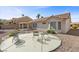 Well-maintained backyard with a patio and desert landscaping offering a peaceful outdoor space at 10413 Marymont Pl, Las Vegas, NV 89134