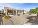 Charming backyard with a covered patio and desert landscaping, great for low-maintenance living at 10413 Marymont Pl, Las Vegas, NV 89134