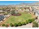 Aerial view of a baseball field, set in a residential community with mountain views and mature landscaping at 10413 Marymont Pl, Las Vegas, NV 89134