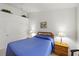 Carpeted bedroom featuring a cozy bed with bedside tables and a closet at 10413 Marymont Pl, Las Vegas, NV 89134