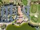 Aerial view of a clubhouse near a golf course, pond and parking at 10413 Marymont Pl, Las Vegas, NV 89134