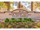 The Palm Valley Golf Club sign in Sun City Summerlin is surrounded by shrubs and blooming flowers at 10413 Marymont Pl, Las Vegas, NV 89134