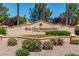 Entrance sign for Sun City Summerlin surrounded by mature landscaping at 10413 Marymont Pl, Las Vegas, NV 89134