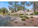 The Sun City Summerlin community sign is surrounded by shrubs and blooming flowers on a sunny day at 10413 Marymont Pl, Las Vegas, NV 89134