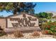 The Highland Falls Golf Club sign sits amongst desert landscaping with a mountain backdrop at 10413 Marymont Pl, Las Vegas, NV 89134