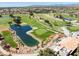 Scenic view of the lush golf course, water feature, and manicured green at this community at 10413 Marymont Pl, Las Vegas, NV 89134