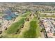 Scenic aerial view of the golf course featuring lush green fairways and manicured greens within a residential community at 10413 Marymont Pl, Las Vegas, NV 89134