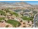 Expansive golf course showcasing lush fairways, sand traps, and surrounding neighborhood with a stunning mountain backdrop at 10413 Marymont Pl, Las Vegas, NV 89134