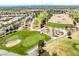 Golf course showing pristine greens and manicured landscaping, nestled within a community with expansive views of the city at 10413 Marymont Pl, Las Vegas, NV 89134