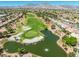 Picturesque view of a pond on the golf course, surrounded by greenery and upscale homes at 10413 Marymont Pl, Las Vegas, NV 89134