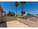 Spacious balcony offering neighborhood views and two tall palm trees at 1054 Broomfield Dr, Henderson, NV 89074