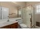 Updated bathroom featuring a glass shower, toilet and modern sink at 1054 Broomfield Dr, Henderson, NV 89074