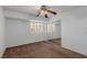 Empty bedroom with neutral walls, ceiling fan, carpet flooring and window at 1054 Broomfield Dr, Henderson, NV 89074