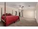 Spacious primary bedroom with a four poster bed, ceiling fan, and neutral paint at 1054 Broomfield Dr, Henderson, NV 89074