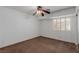 Empty bedroom with neutral walls, fan, and a large sliding glass window at 1054 Broomfield Dr, Henderson, NV 89074