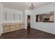 Dining room with built-in storage and display shelves with views into the kitchen and living room at 1054 Broomfield Dr, Henderson, NV 89074