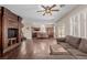 Open floor plan featuring the kitchen island, living room, and built-in entertainment center at 1054 Broomfield Dr, Henderson, NV 89074