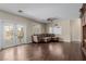 Spacious living room featuring hardwood floors and a comfortable sectional sofa at 1054 Broomfield Dr, Henderson, NV 89074